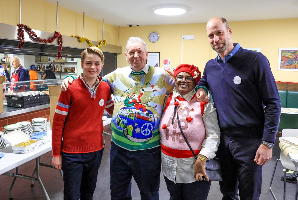 Prince William and Prince George with staff at a homeless shetler